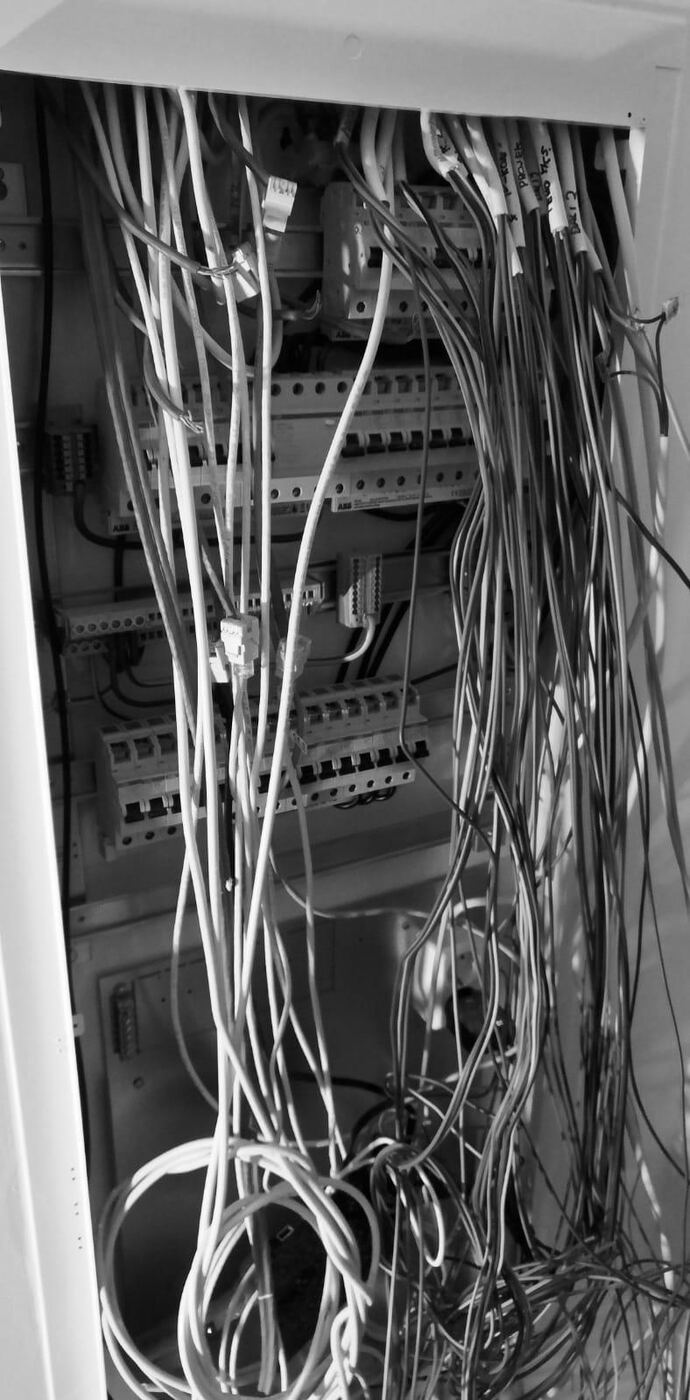 A distribution board during replacement, with the circuit conductors disconnected.